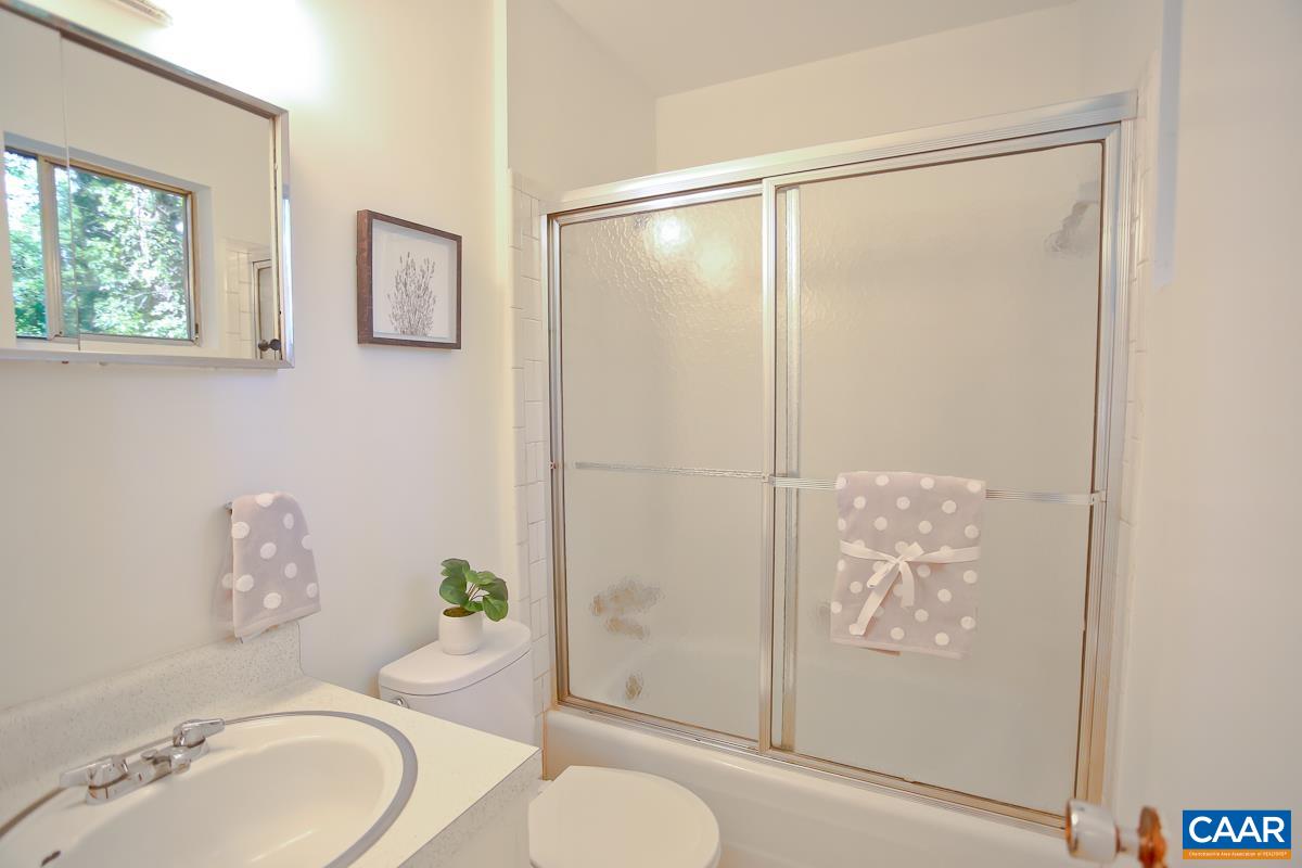 1514 Trailridge Road Charlottesville, VA 22903 - Photo 13 of 23 a bathroom with a granite countertop sink toilet and shower