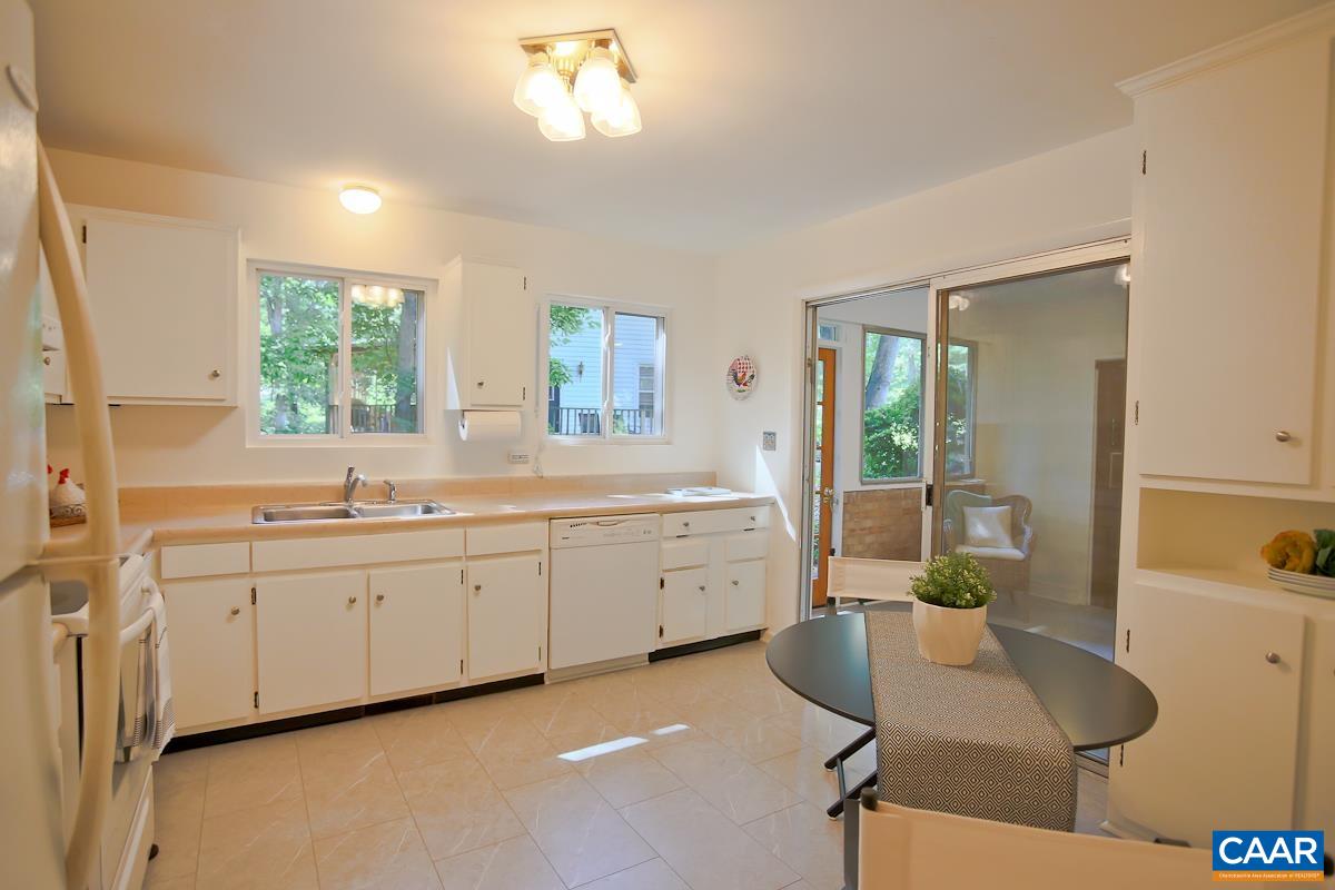 1514 Trailridge Road Charlottesville, VA 22903 - Photo 6 of 23 a large white kitchen with a window and furniture
