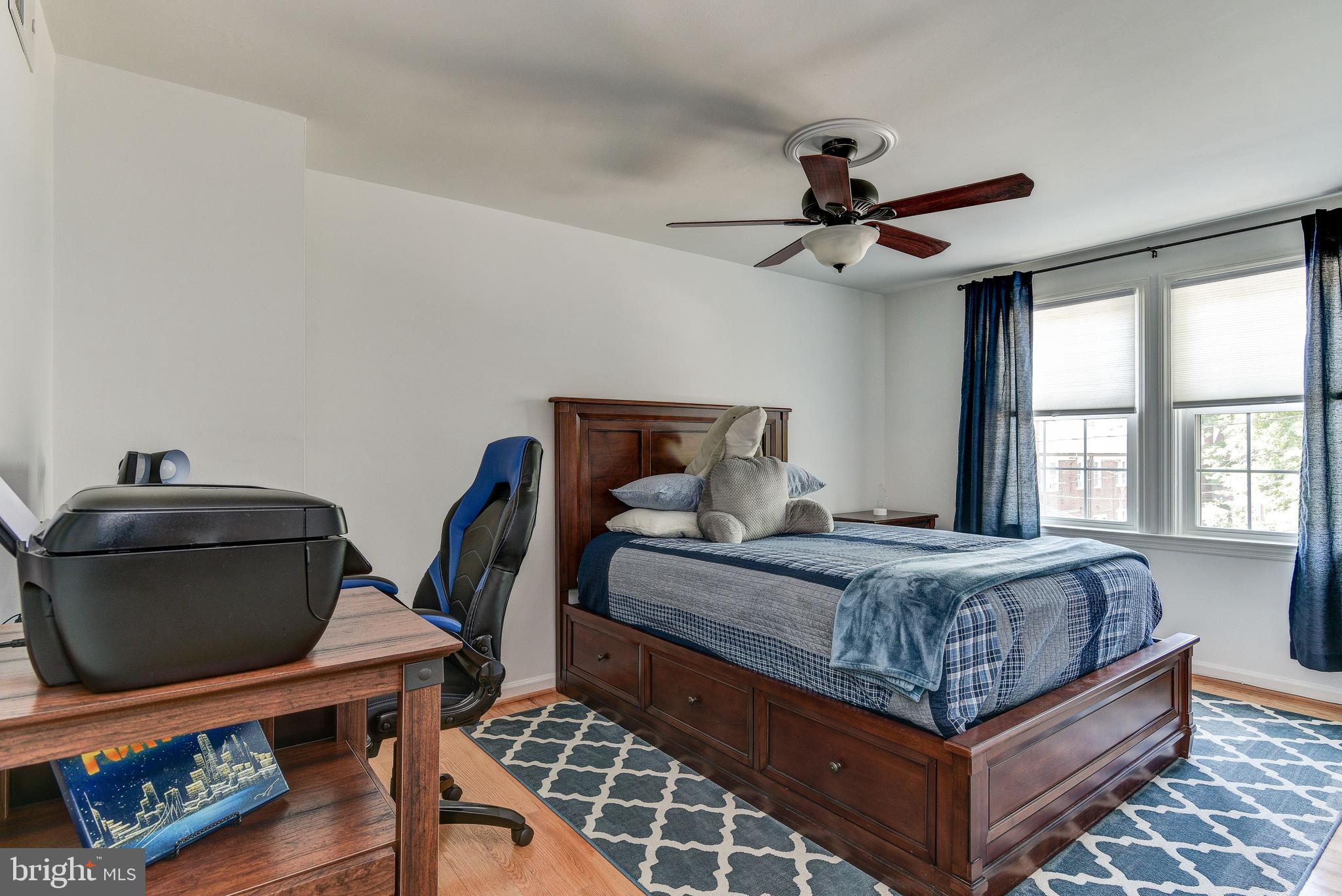 506 Academy Road Baltimore, MD 21228 - Photo 26 of 49 a bedroom with a bed and window