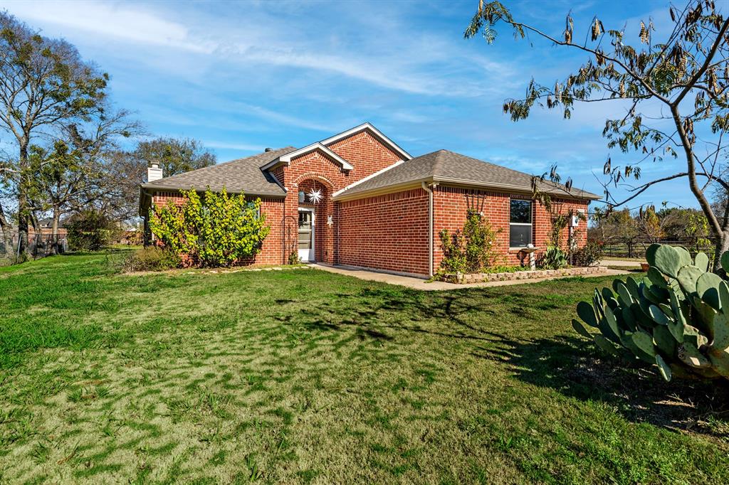 front view of a house with a big yard