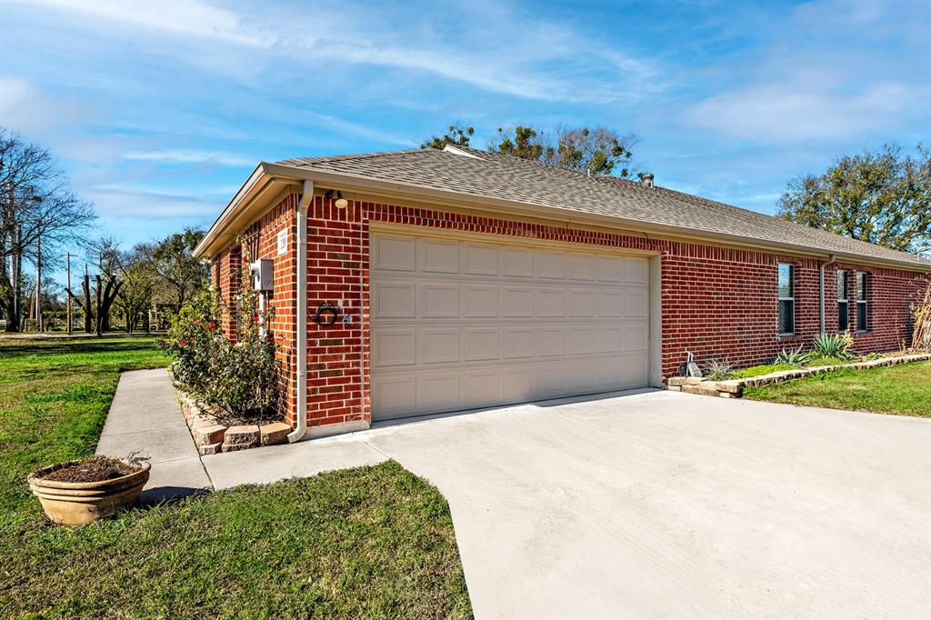 1209 Sherman Street Tioga, TX 76271 - Photo 11 of 40 a front view of a house with a yard
