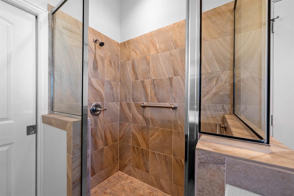 1209 Sherman Street Tioga, TX 76271 - Photo 36 of 40 a bathroom with a glass shower door