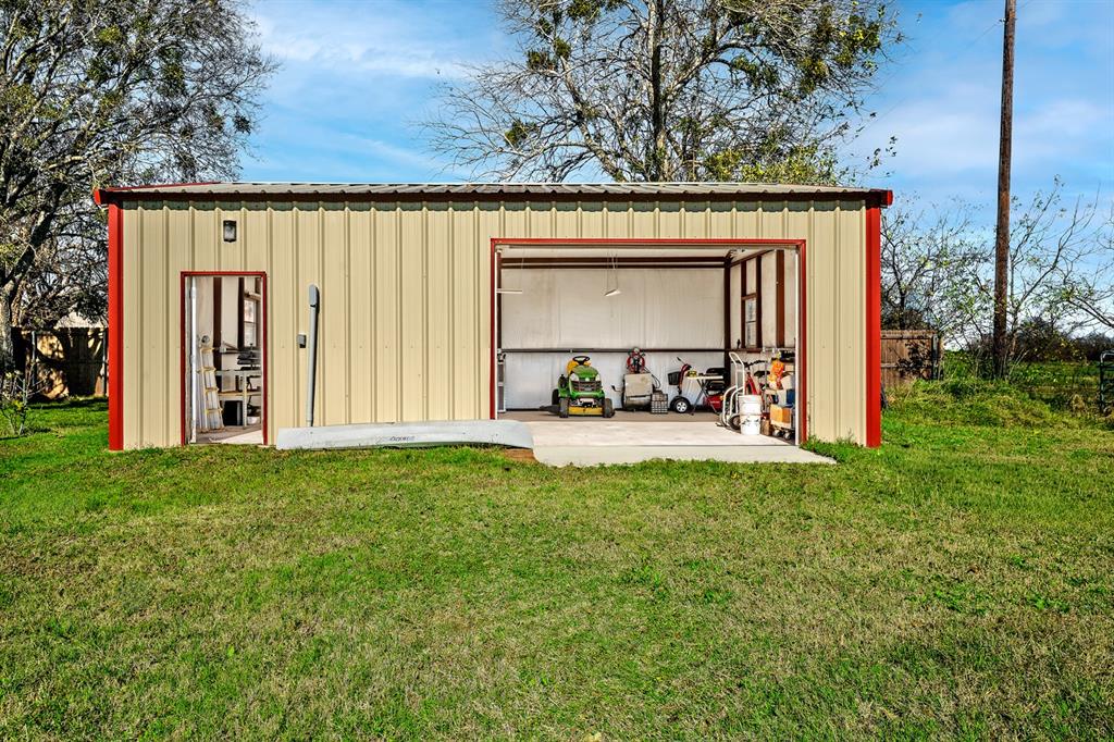 1209 Sherman Street Tioga, TX 76271 - Photo 5 of 40 a view of a back yard from a living room