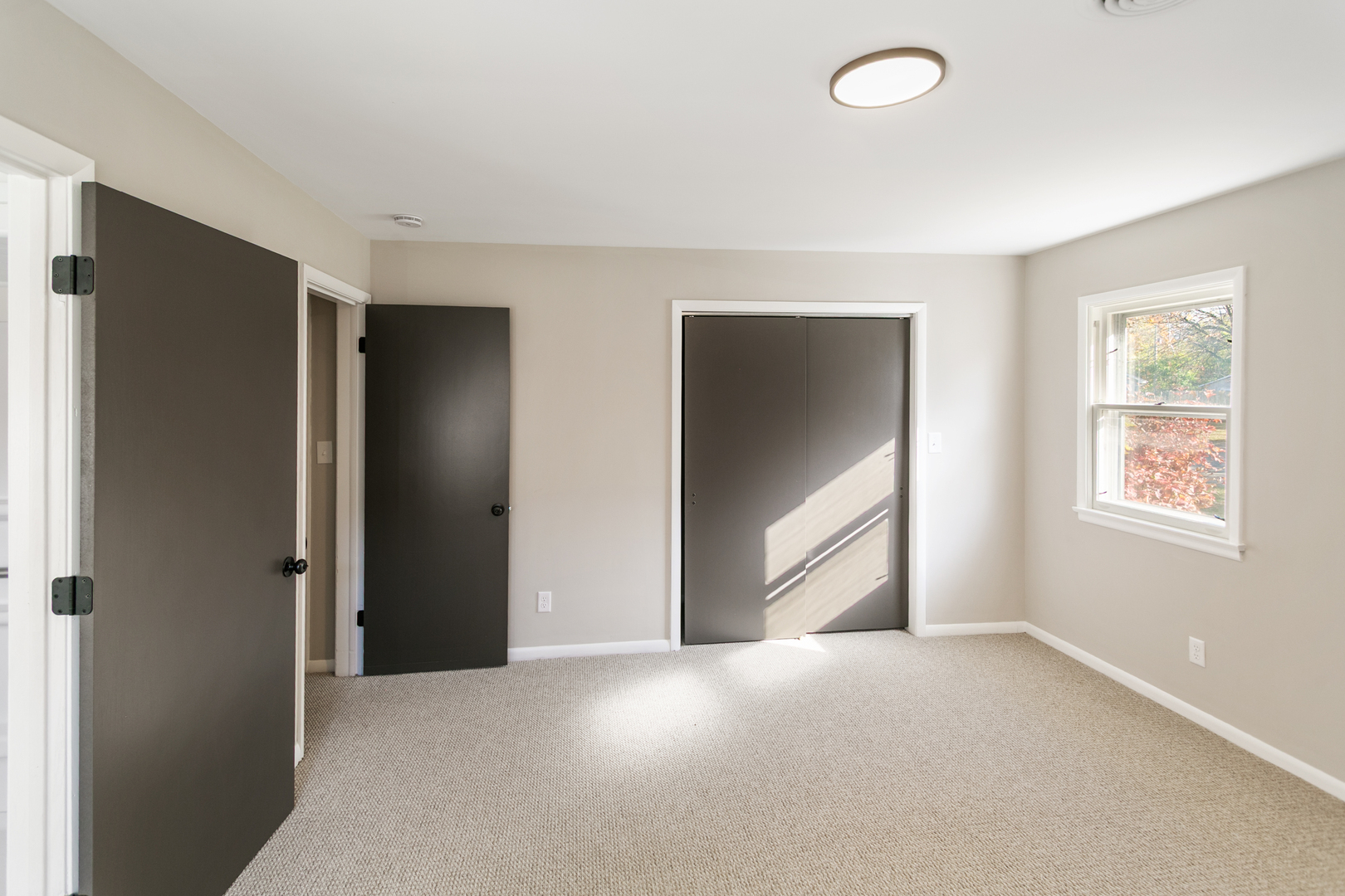 1431 West Vanmeter Street Kankakee, IL 60901 - Photo 12 of 19 an empty room with windows and closet