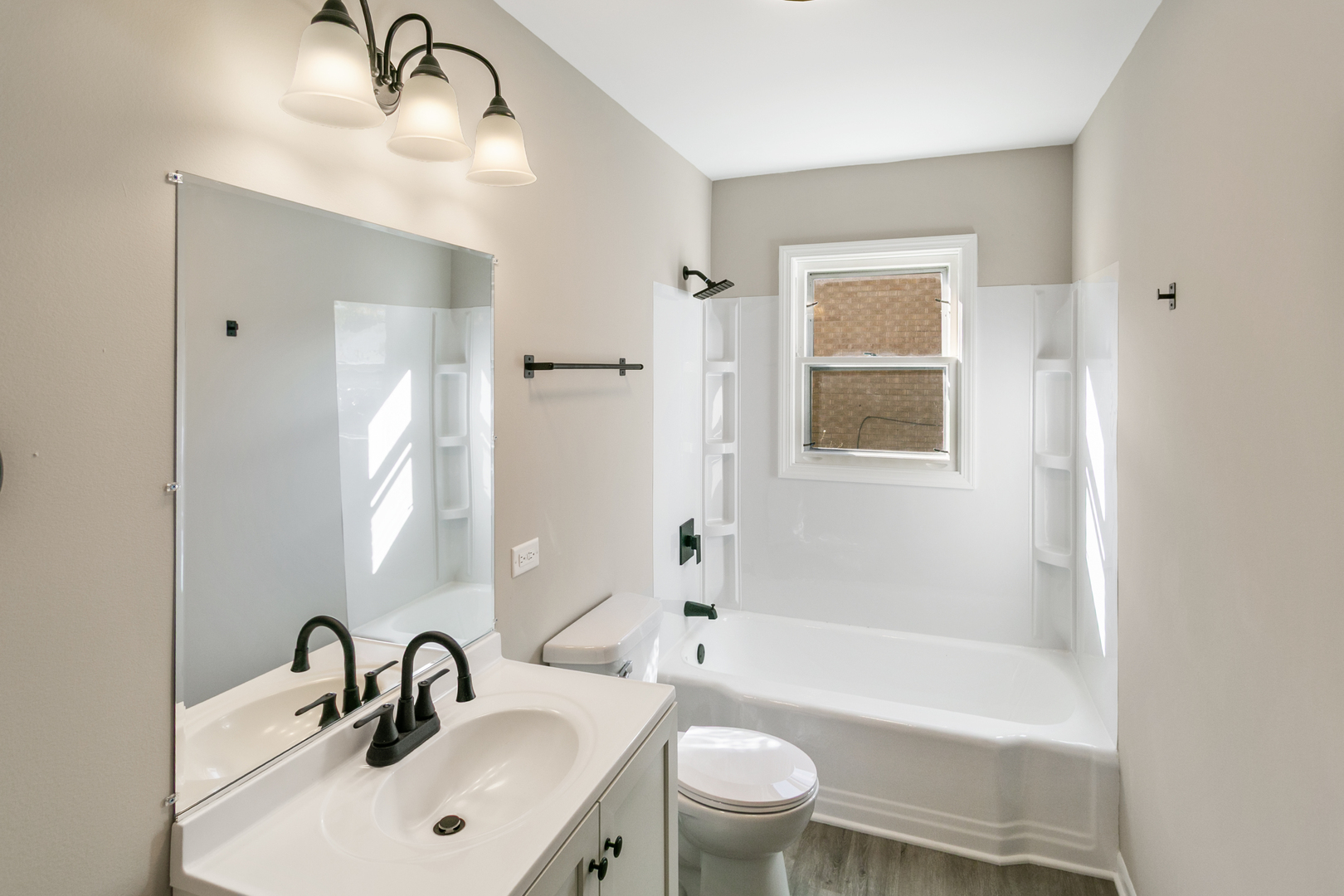 1431 West Vanmeter Street Kankakee, IL 60901 - Photo 14 of 19 a bathroom with a sink mirror toilet and bathtub
