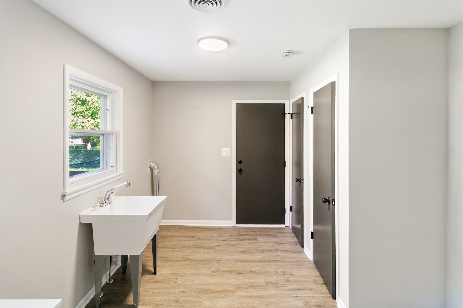 1431 West Vanmeter Street Kankakee, IL 60901 - Photo 7 of 19 a view of a room with wooden floor and furniture