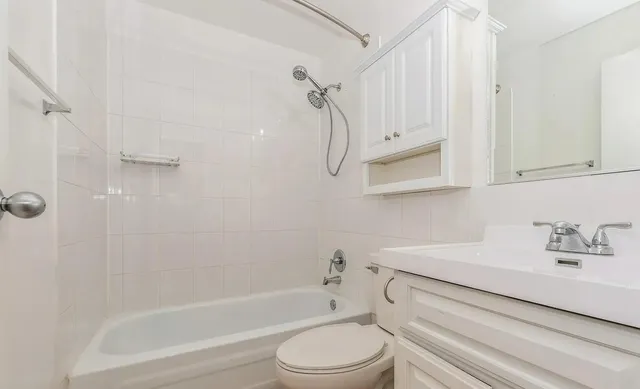 a bathroom with a sink a toilet and a bathtub