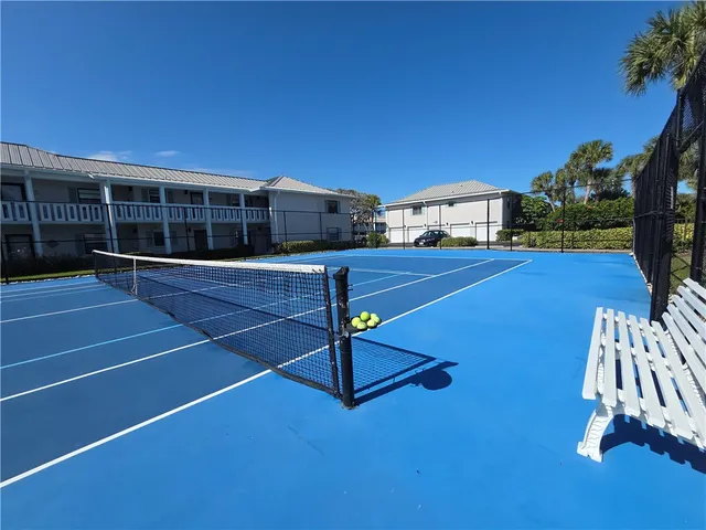 a kitchen with wooden cabinets and stainless steel appliances