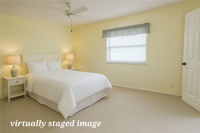 a view of a livingroom with furniture and a bookshelf