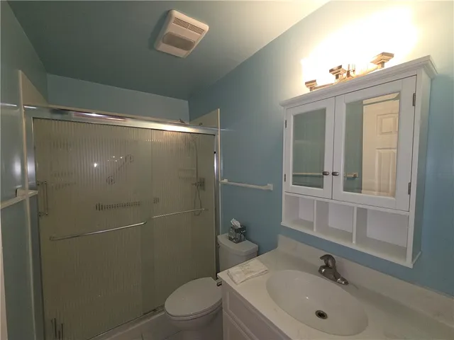 a view of a backyard with a garden and plants