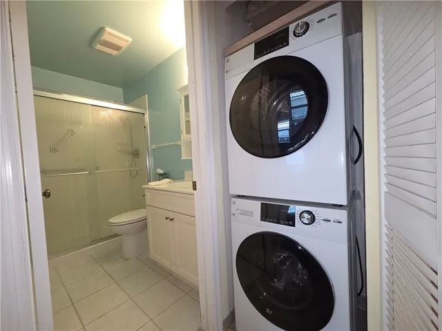 a room with pool table and window