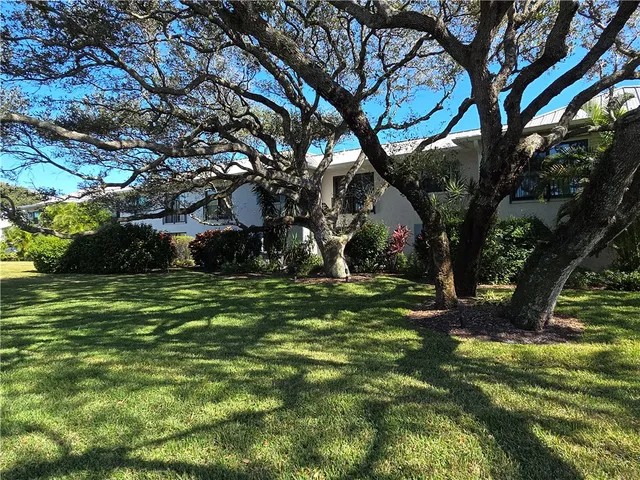 a front view of a house with parking space