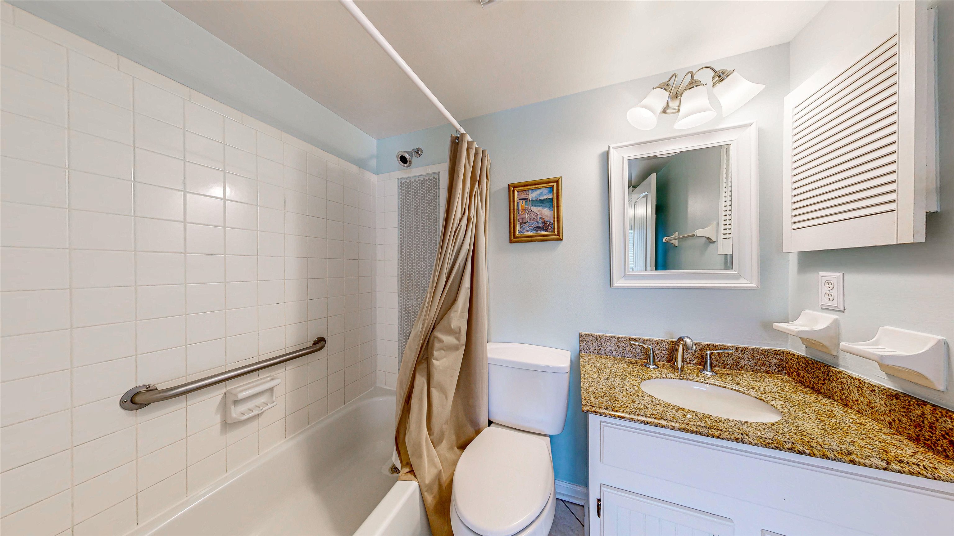 880 A1A Beach Boulevard, Unit 3207 St. Augustine, FL 32080 - Photo 12 of 33 a bathroom with a granite countertop sink and a mirror