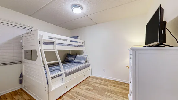 a view of living room with furniture and a flat screen tv