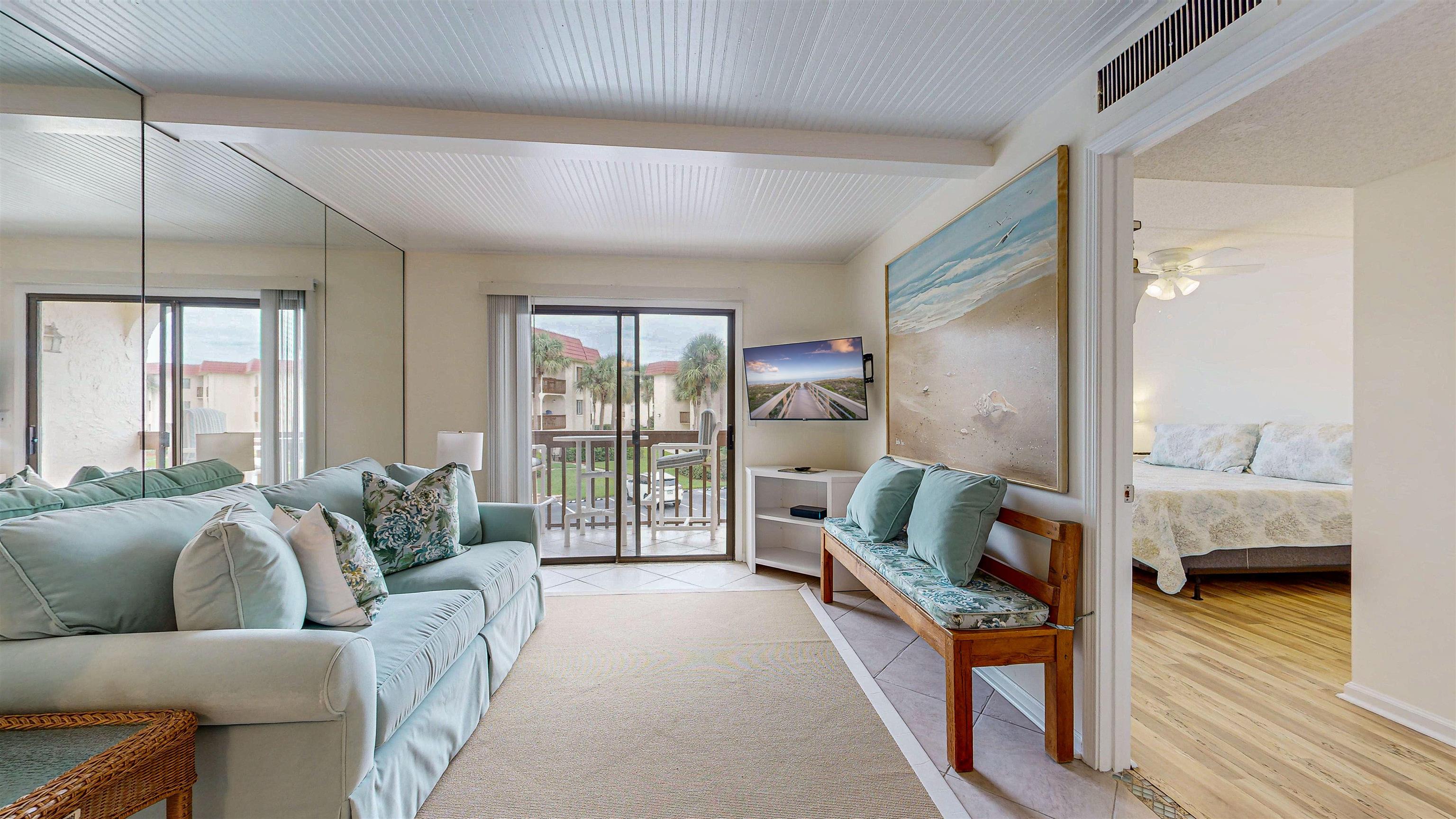 880 A1A Beach Boulevard, Unit 3207 St. Augustine, FL 32080 - Photo 2 of 33 a living room with furniture and a large window