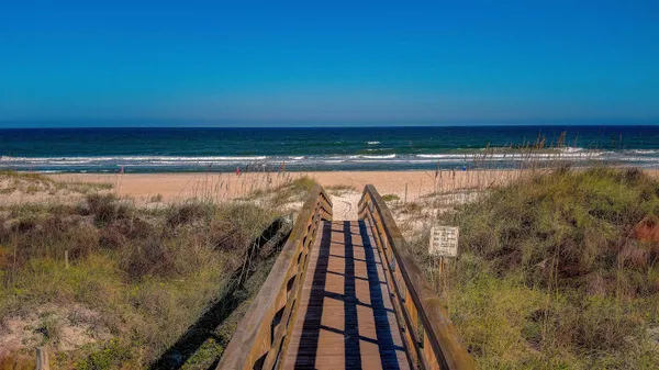 a view of balcony with wooden floor