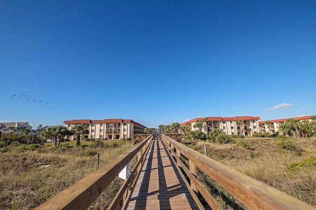 a view of balcony with wooden floor