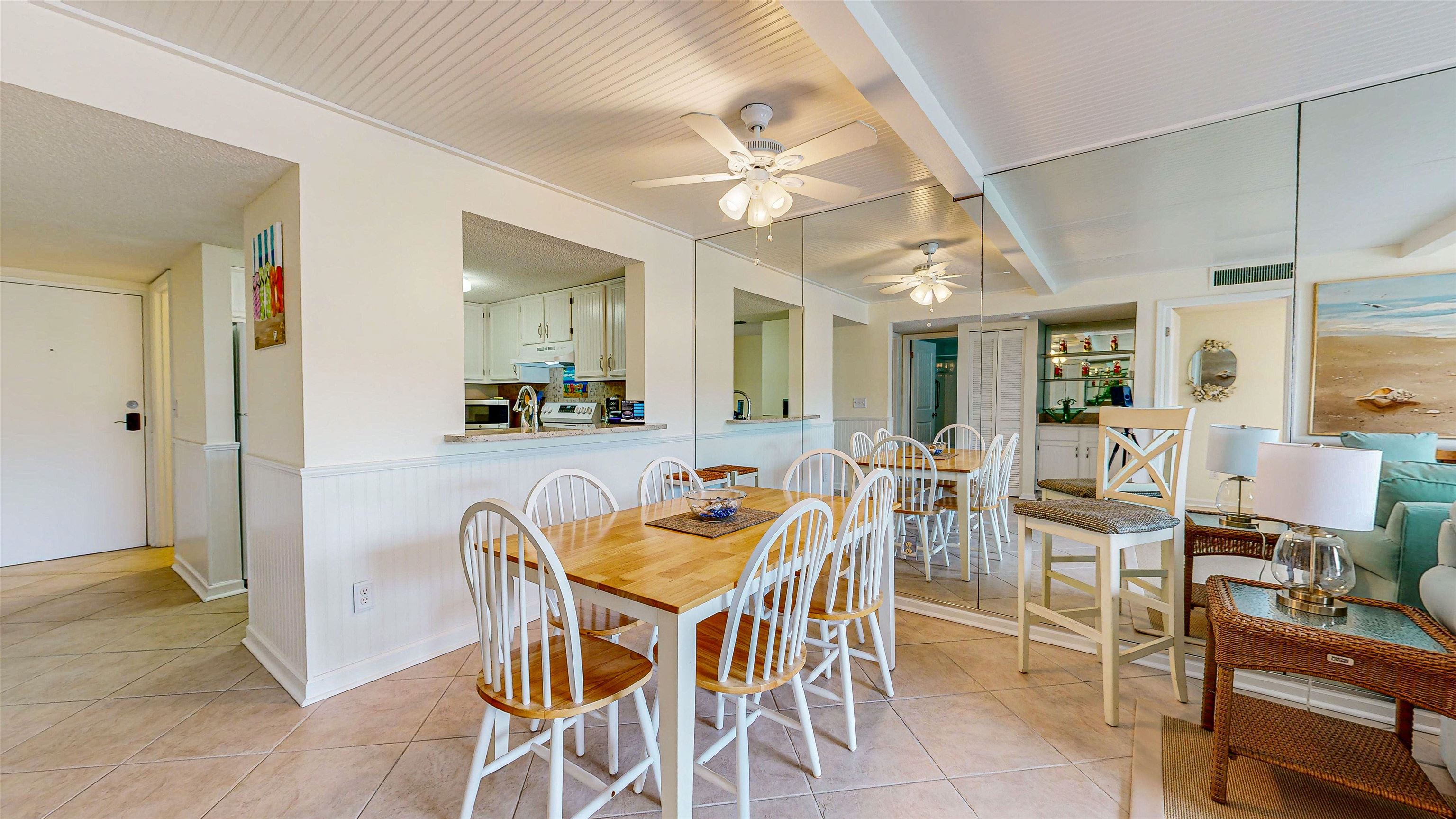 880 A1A Beach Boulevard, Unit 3207 St. Augustine, FL 32080 - Photo 6 of 33 a view of a dining room with furniture and a chandelier