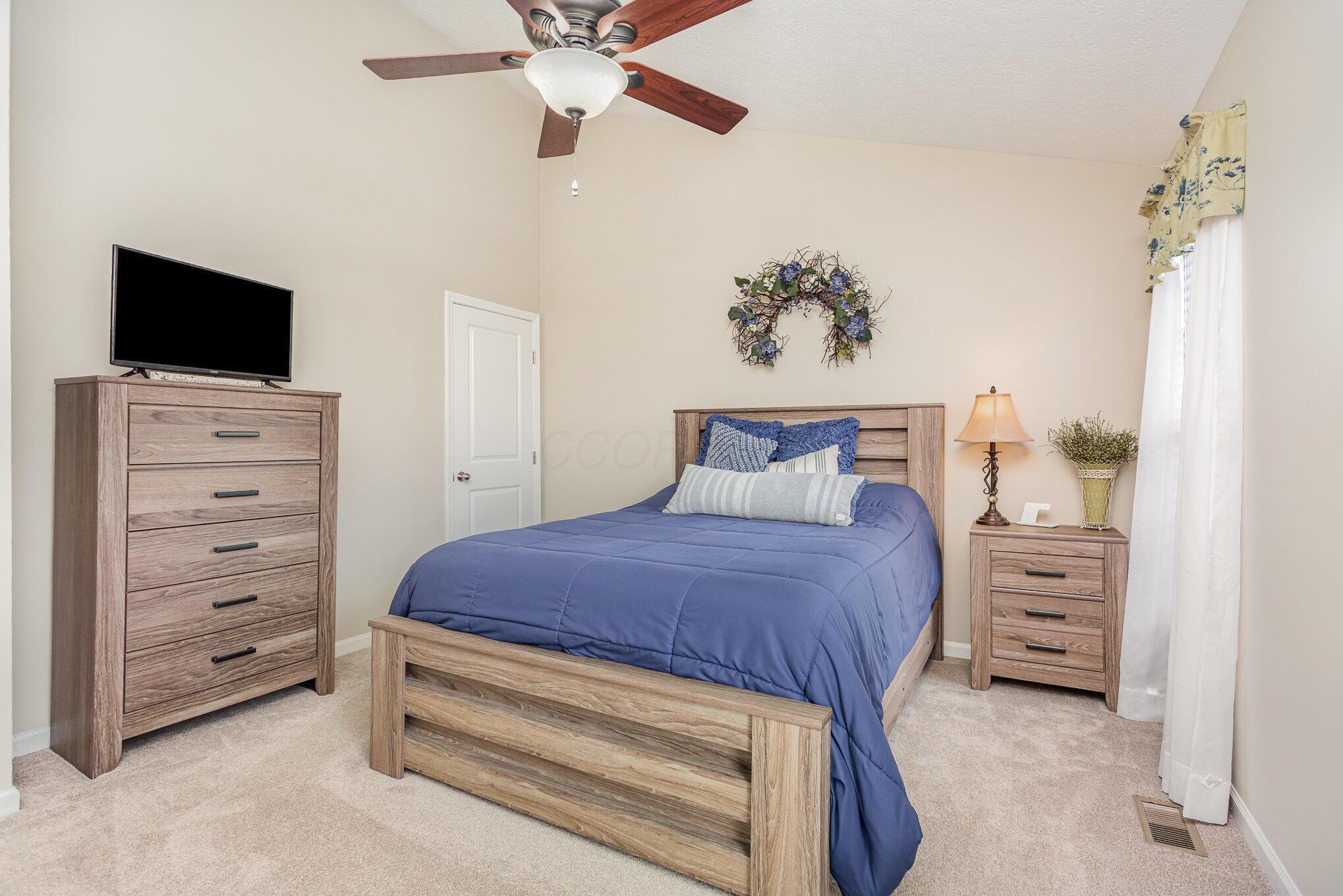 6289 Needletail Road Columbus, OH 43230 - Photo 13 of 23 This bedroom has loads of space and a private bathroom.