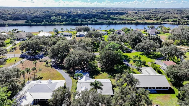 an aerial view of a house with a lake view