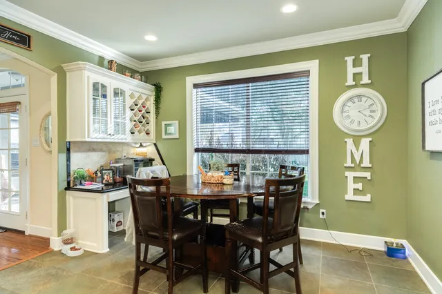 a bed room with a bed and a chair