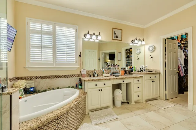 a view of a hallway with wooden floor and entryway