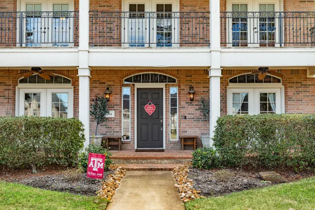 a view of a patio with table and chairs and potted plants