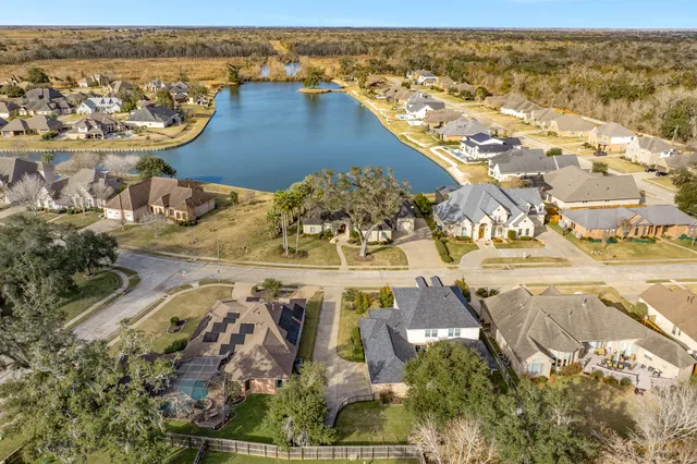 an aerial view of residential houses with outdoor space