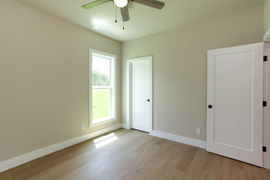 803 Oconner Smithville, TN 37166 - Photo 14 of 26 an empty room with wooden floor and windows