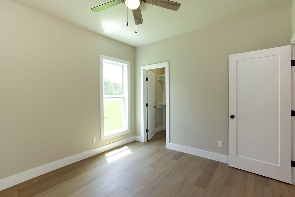 803 Oconner Smithville, TN 37166 - Photo 15 of 26 an empty room with wooden floor and windows