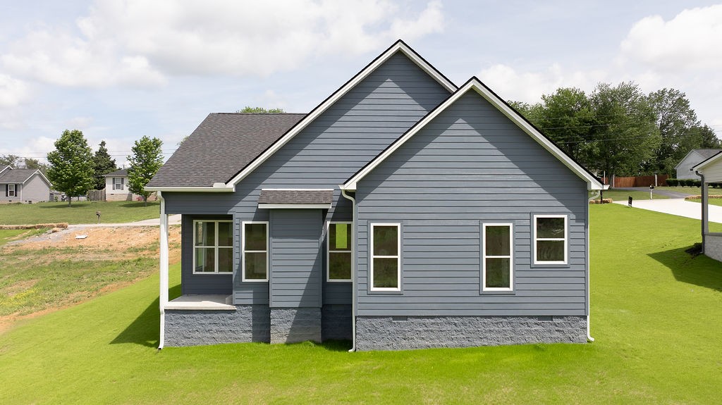 803 Oconner Smithville, TN 37166 - Photo 23 of 26 a view of a house with a yard potted plants and a table