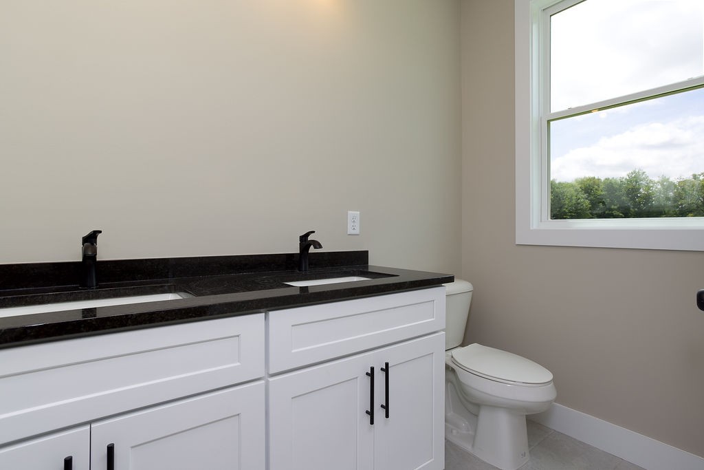 803 Oconner Smithville, TN 37166 - Photo 10 of 26 a view of a toilet sink and mirror