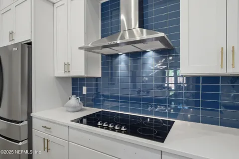 a kitchen with stainless steel appliances a sink a stove and a microwave