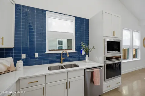 a kitchen with a table and chairs in it