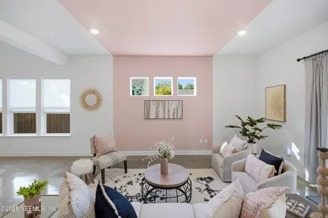 a living room with furniture and a table