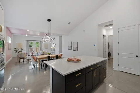 a kitchen with a table and chairs