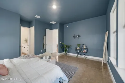 a view of storage and utility room with racks on the wall