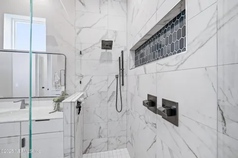 a bathroom with a sink toilet and mirror
