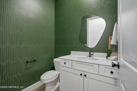 a bathroom with a sink a vanity and a mirror