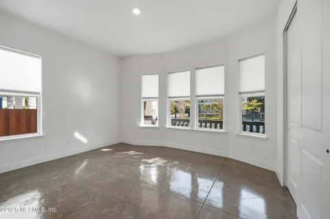 a bathroom with a toilet and a bathtub