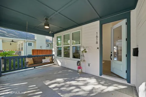a view of a balcony with wooden floor