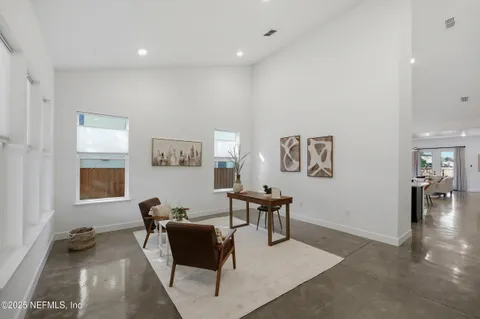 a view of a dining room with furniture window and outside view