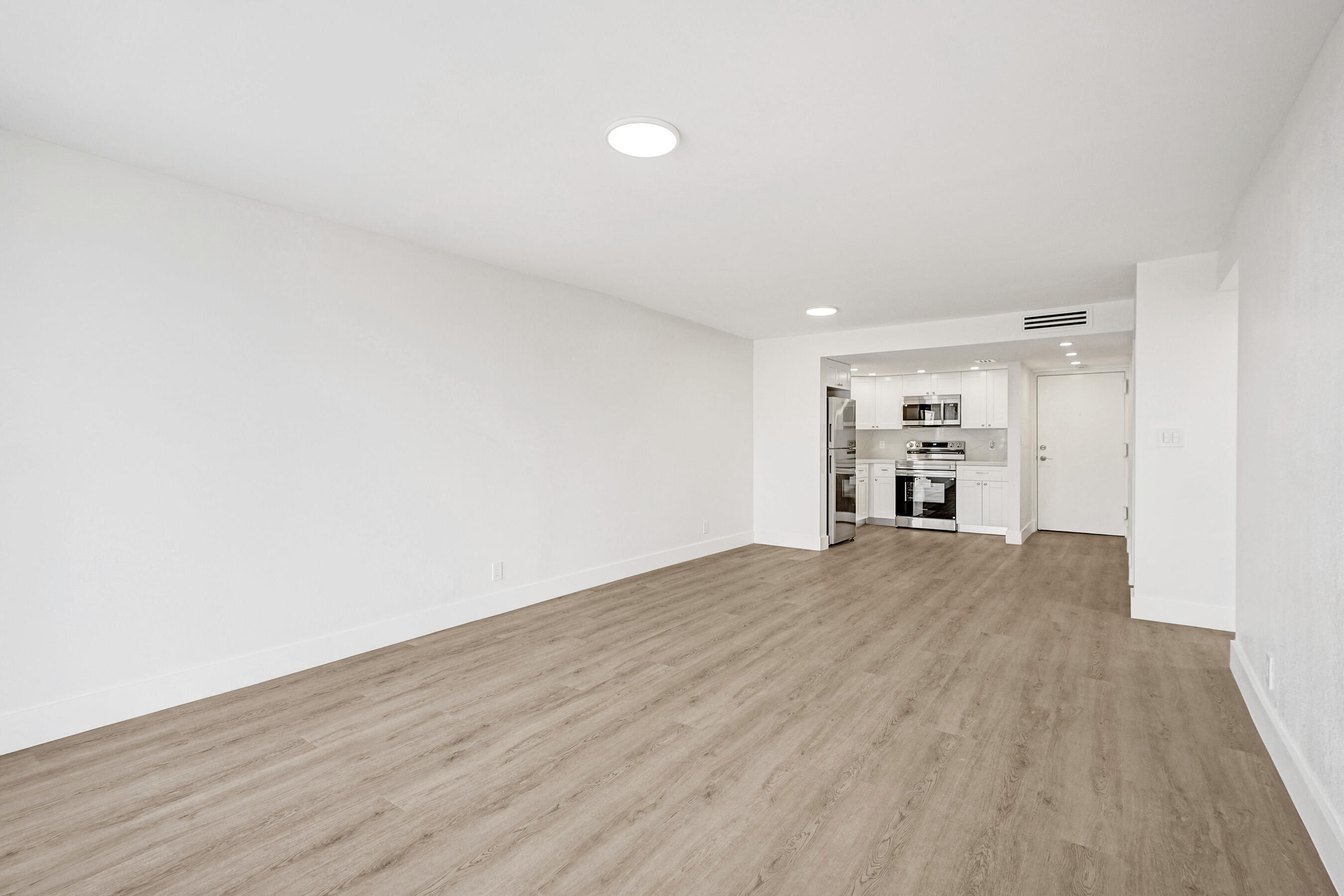 6195 Rock Island Road, Unit 413 Tamarac, FL 33319 - Photo 15 of 37 a view of empty room with wooden floor