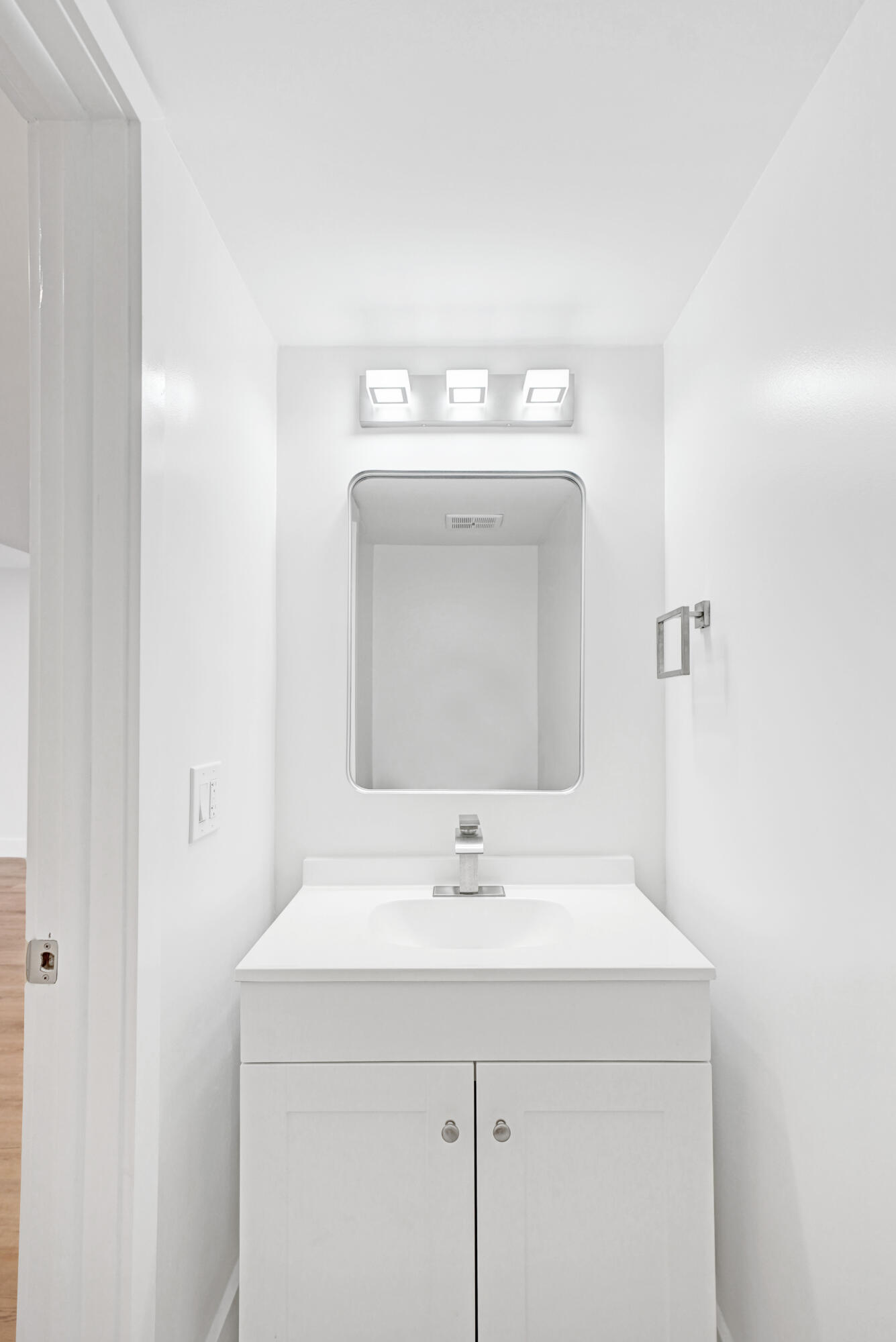 6195 Rock Island Road, Unit 413 Tamarac, FL 33319 - Photo 20 of 37 a bathroom with a sink and a mirror