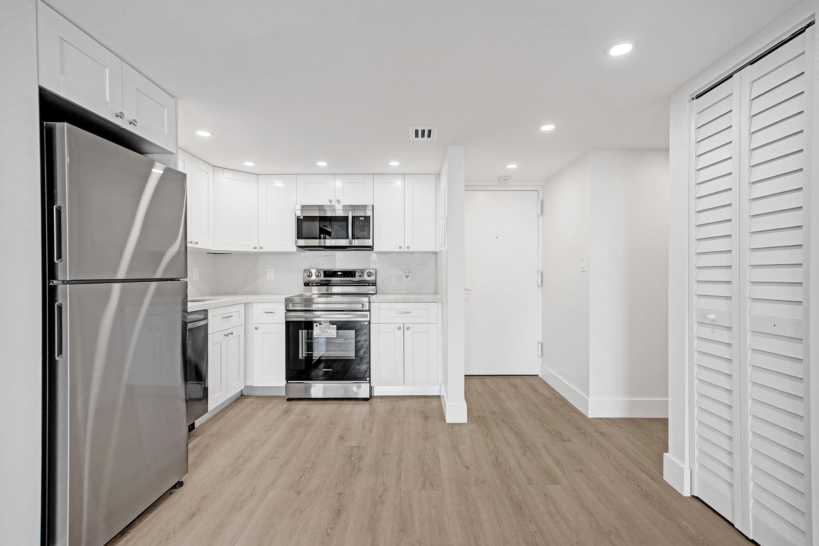 6195 Rock Island Road, Unit 413 Tamarac, FL 33319 - Photo 3 of 37 a kitchen with a refrigerator a stove and a sink