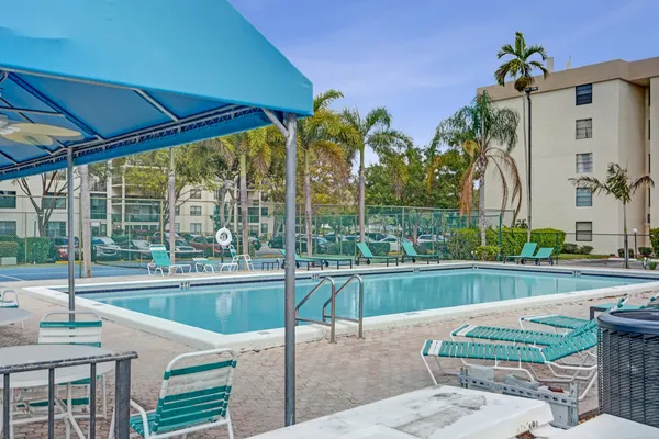 a view of a patio with swimming pool