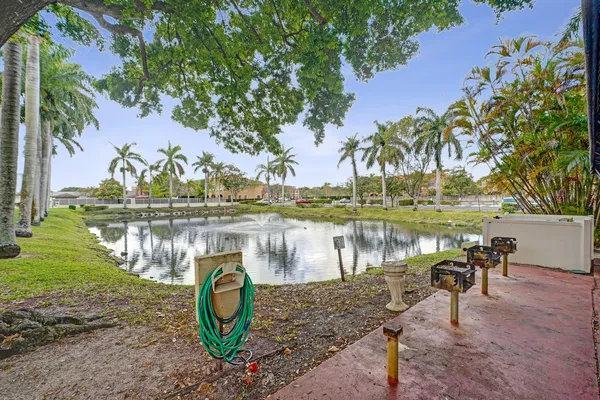 a lake view with a table and chairs