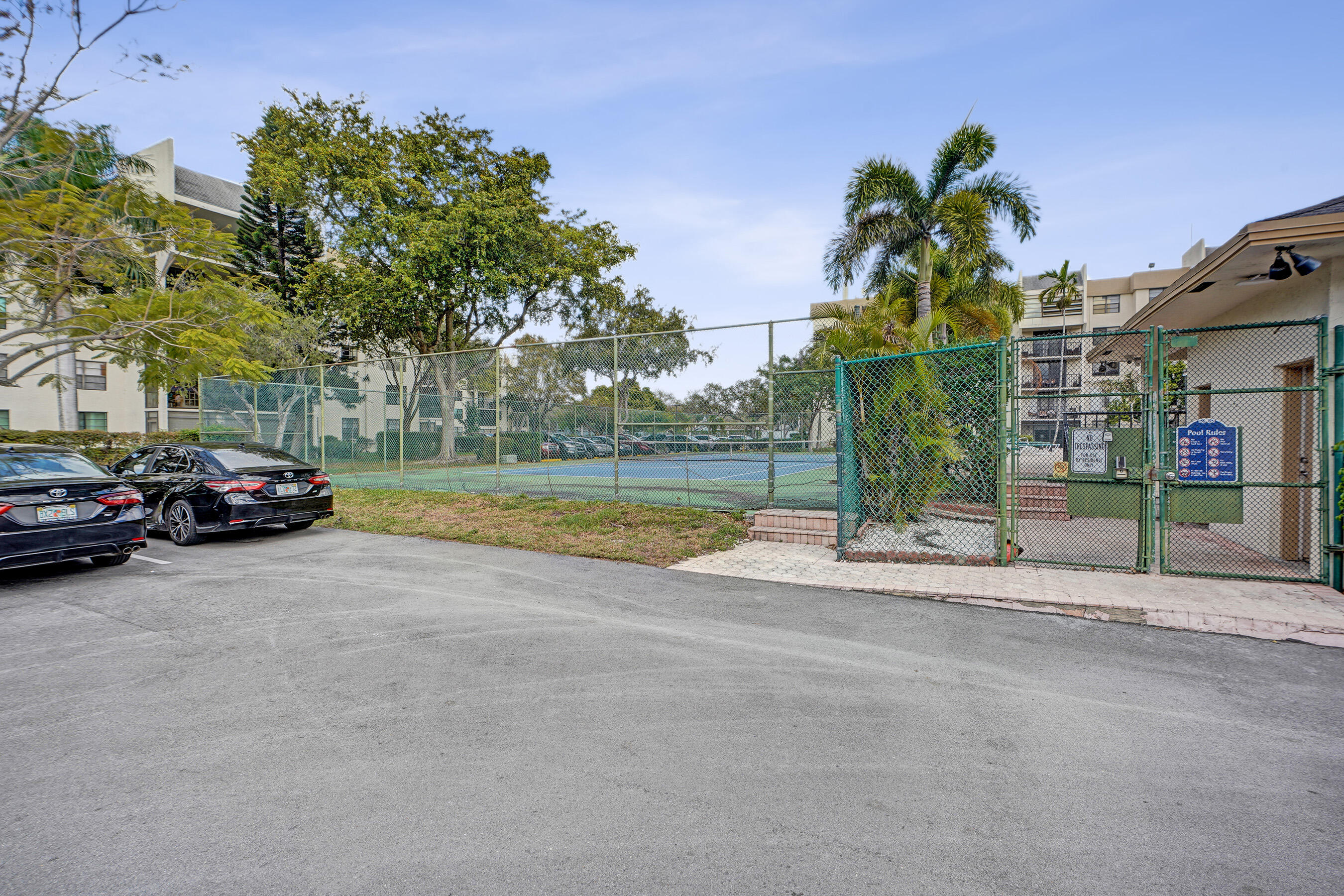 6195 Rock Island Road, Unit 413 Tamarac, FL 33319 - Photo 36 of 37 a view of street with parked cars