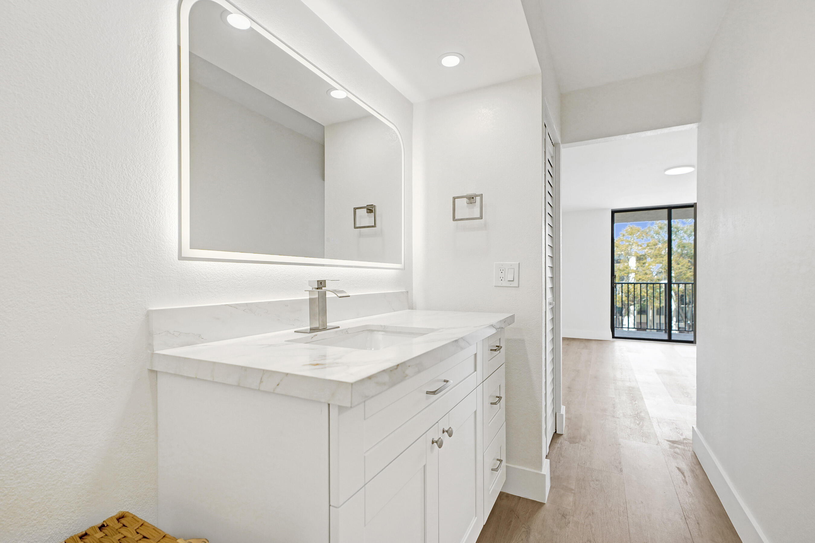6195 Rock Island Road, Unit 413 Tamarac, FL 33319 - Photo 4 of 37 a bathroom with a sink and a mirror