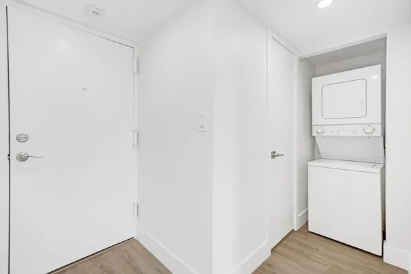 a view of a storage & utility room with a washer dryer